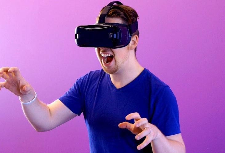 Man experiencing virtual reality, he seems to love it